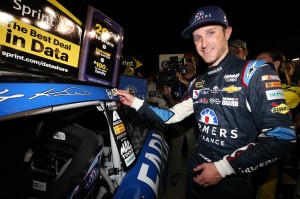 Kasey Kahne applies his winners sticker (photo - Nick Laham/Getty Images for NASCAR)